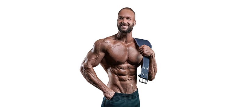 Athlete posing with an athletic belt on a white background. Fitness