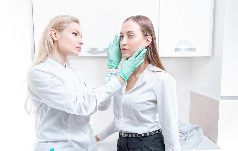 Two girls at the medical center. Consultation on rhinoplasty and blepharoplasty.
