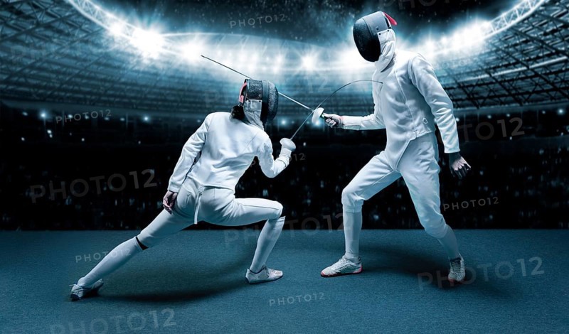 Portrait of two fencers against the backdrop of a sports arena. The concept of fencing. Duel.