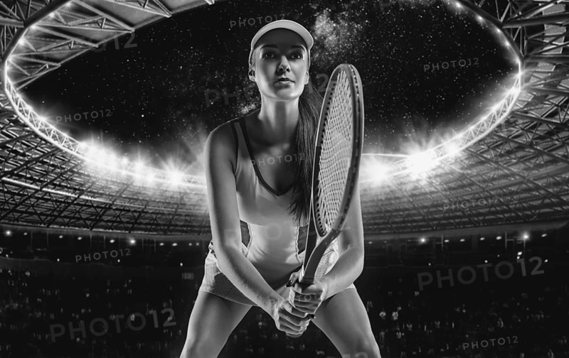 Portrait of a tennis player in a dress on the background of the sports arena.