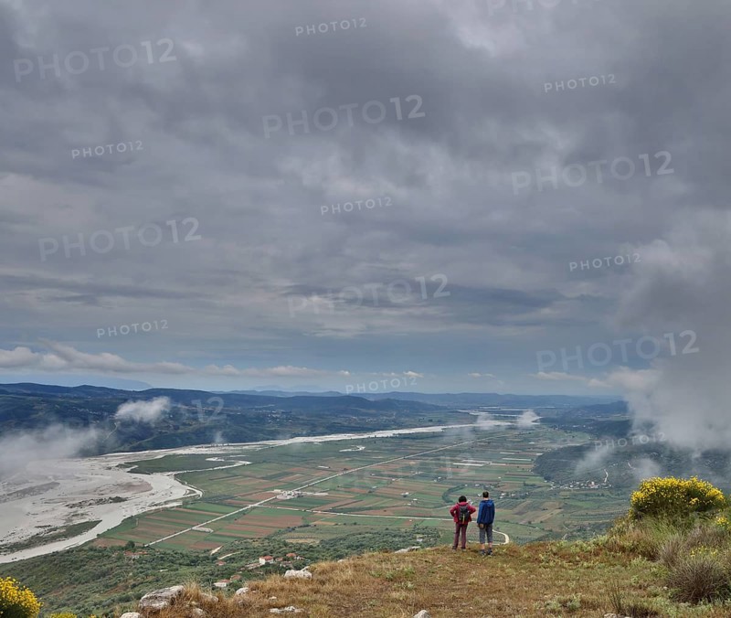 Two visitors marvelling at the view of the Vjosa valley from the Illyrian hilltop settlement of Byllis