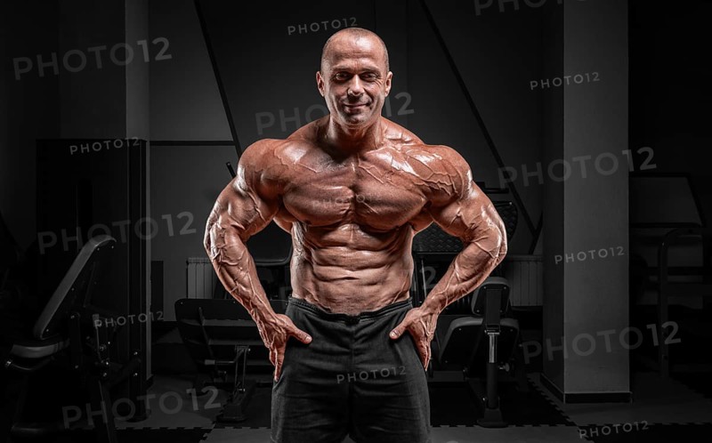 Professional weightlifter posing in the gym. Classic bodybuilding.