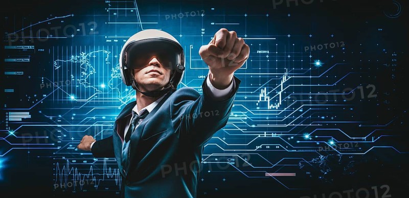 Portrait of a man in a suit and helmet. He shows that he is flying against the background of a futuristic hologram. Business concept. Internet technologies.