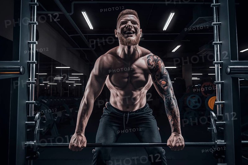 Portrait of an athlete performing a deadlift in the gym. Bodybuilding and fitness concept.