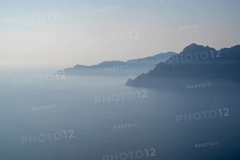 View of a Corsican coastal landscape in fog as texture or background