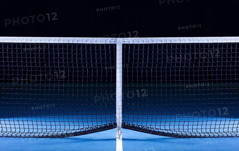 Image of a tennis court with a stretched net. Sports concept.