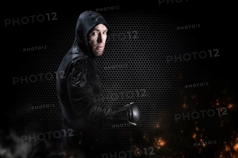 Mixed martial artist goes to battle in a sweatshirt. Concept of mma