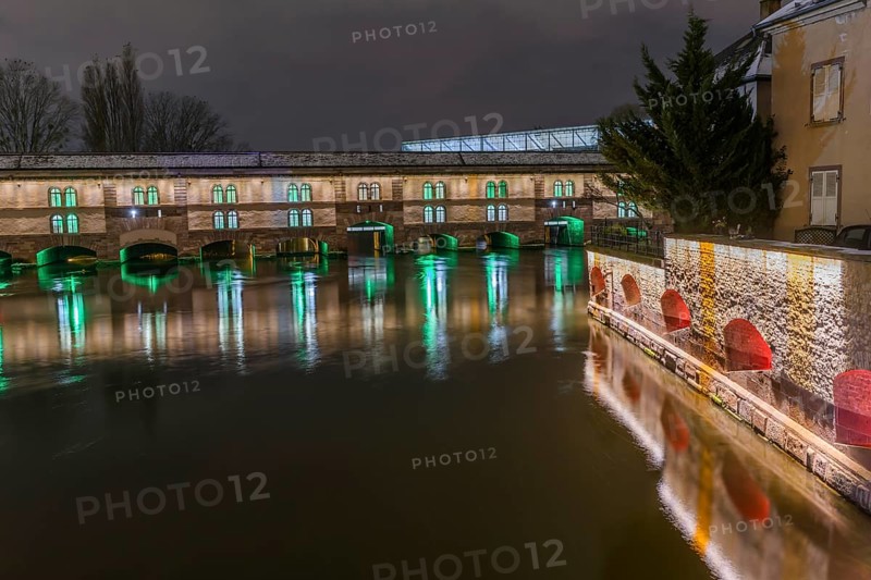 The Vauban dam illuminated at night during Christmas. Strasbourg. Bas-Rhin