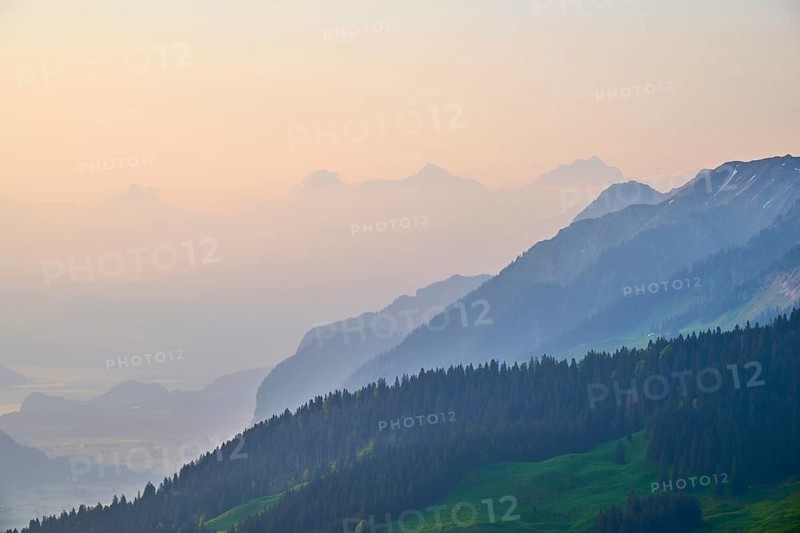 Sunrise over a misty mountain landscape with Eiger