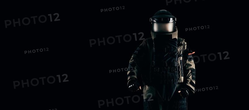 Minesweeper in an armored suit. The concept of anti-terrorism. Black background.