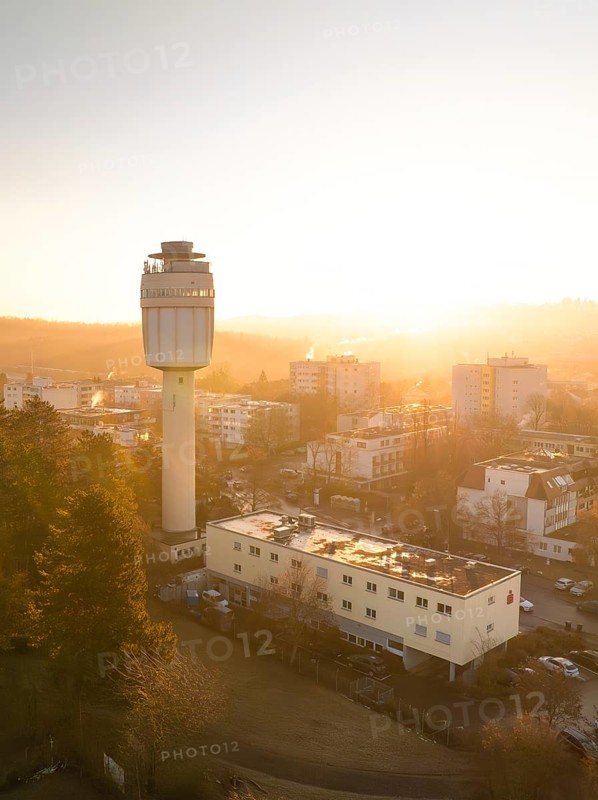 Sunrise behind a water tower