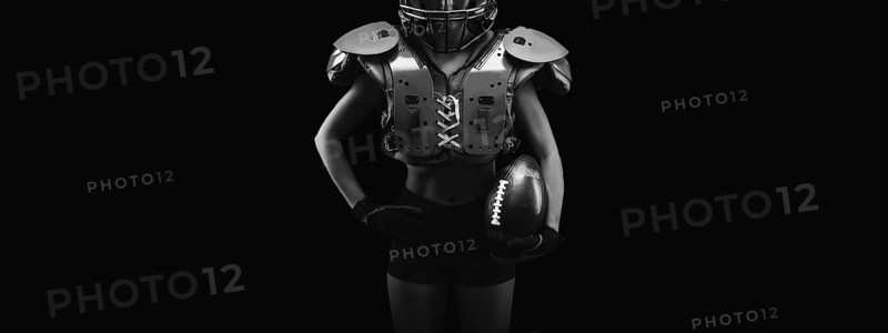 NO name portrait of a woman in shoulders pads. American football. Sports concept.