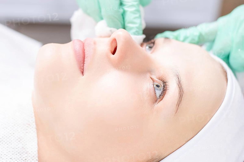 Beautiful girl gets face peeling. Skin health concept. Beauty salons.