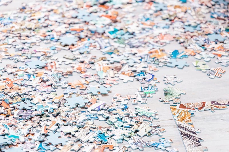 Pieces of puzzles. Home board games. The concept of relaxation and development.
