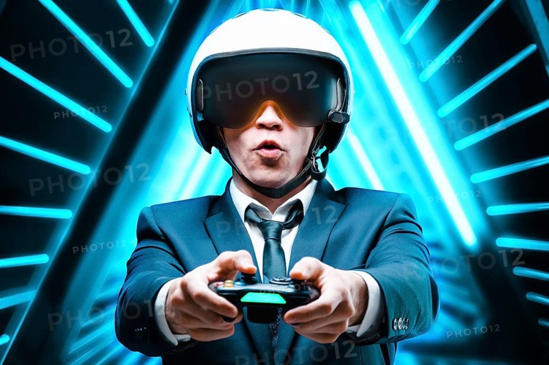 Portrait of an emotional man with a joystick in his hands. ESports. Game concept.