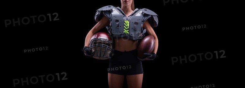 NO name portrait of a woman in shoulders pads. American football. Sports concept.