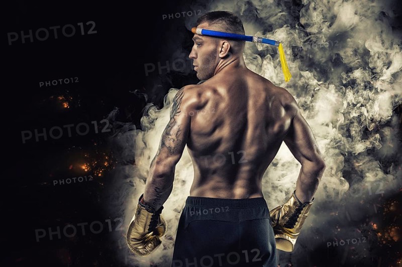 Portrait of a Thai boxer. Back view. Mixed martial arts concept. Competitions and tournaments