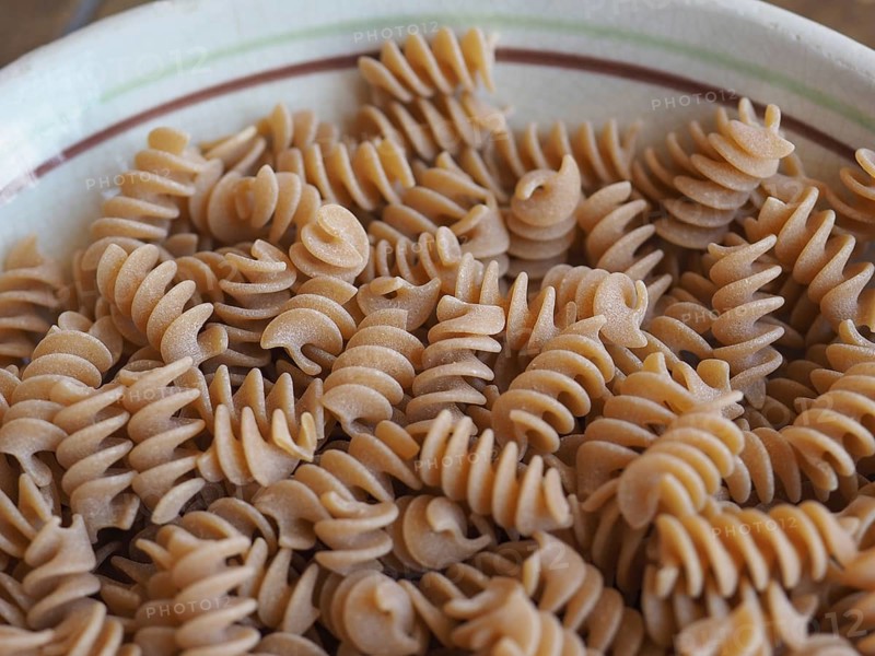 Fusilli Italian pasta background