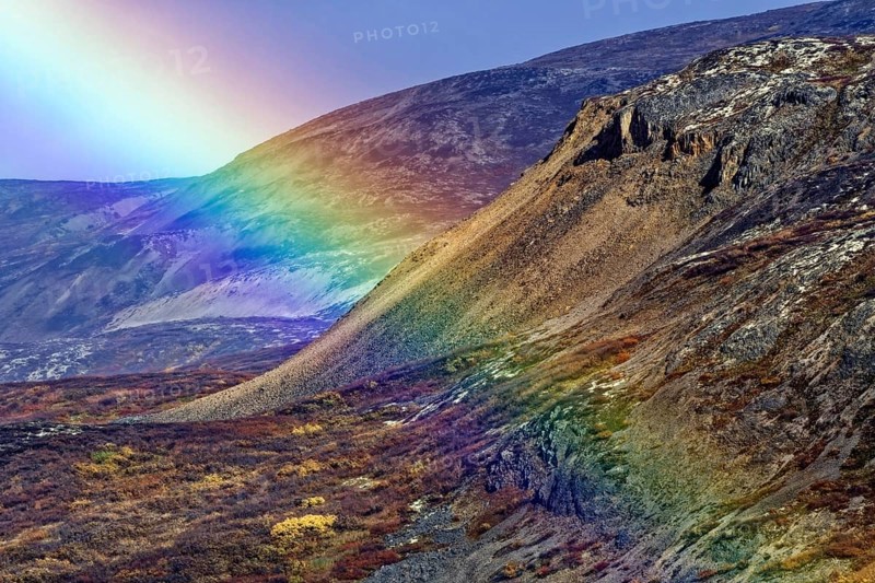 Rainbow over the mountains on the Haines Highway near Haines Junction