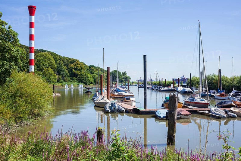 Dinghy harbour or Muehlenberg marina with lighthouse on the Elbe