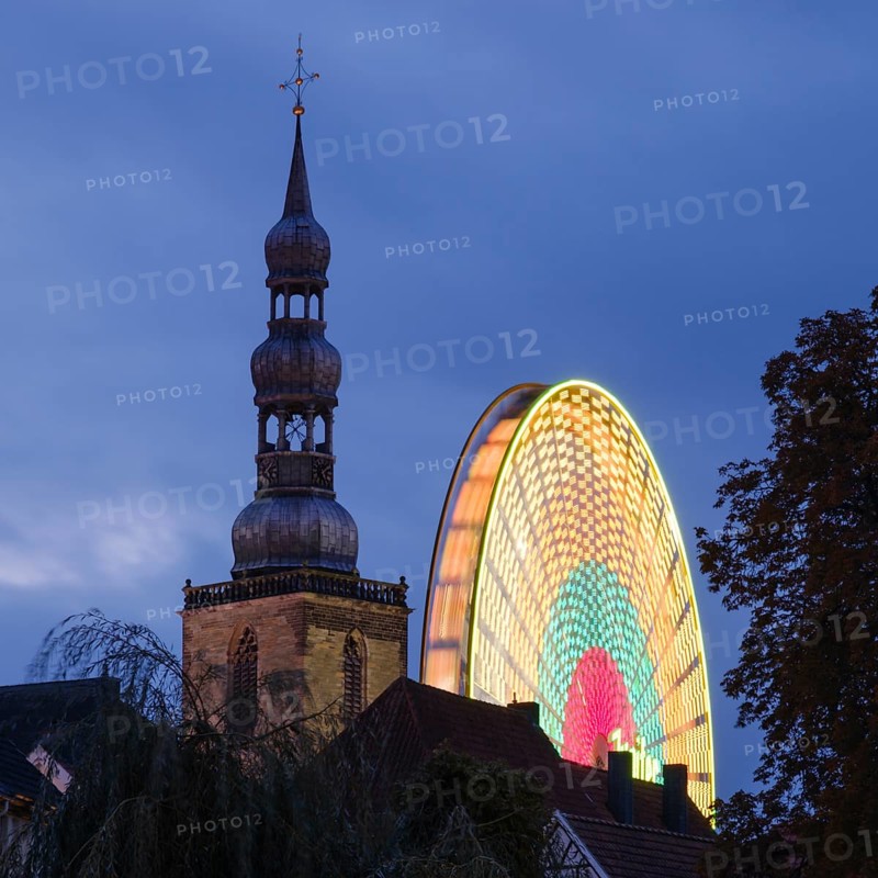 Tower of St Peter's Church with Ferris wheel