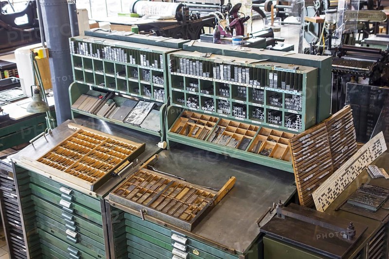 Type case in composing room at printing business