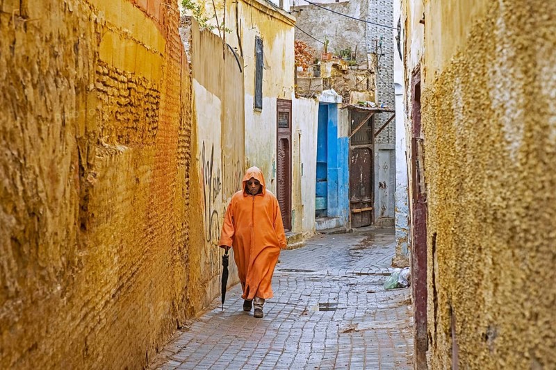 Muslim man wearing orange djellaba