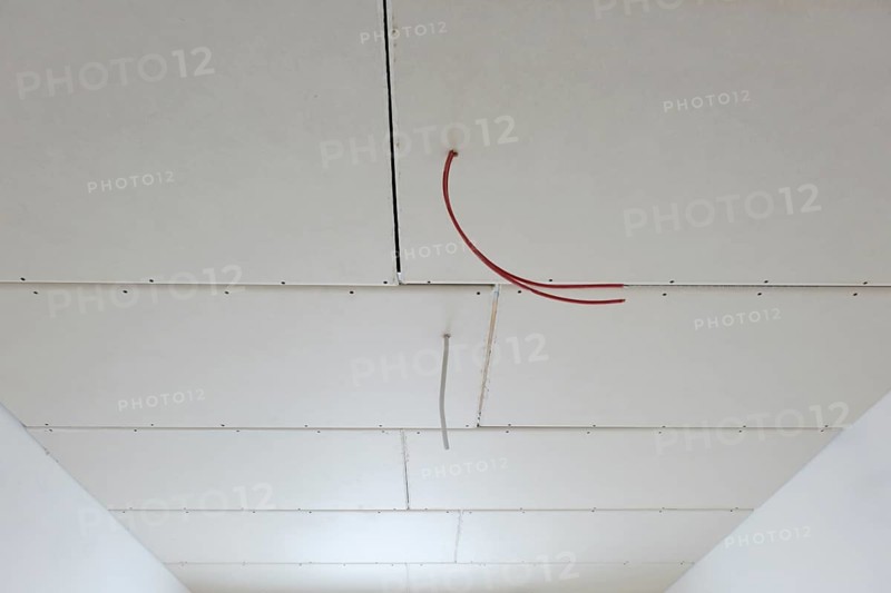 Plasterboard panels under the ceiling