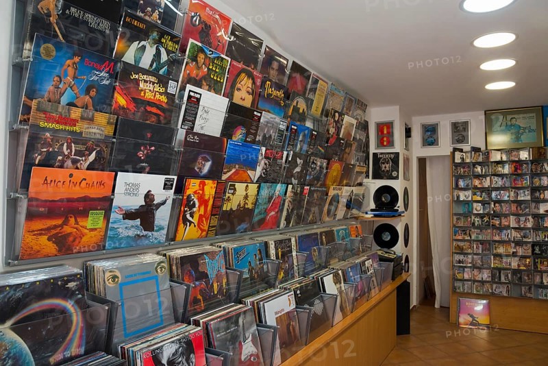 Interior view of a music shop with a wide selection of vinyl records and CDs