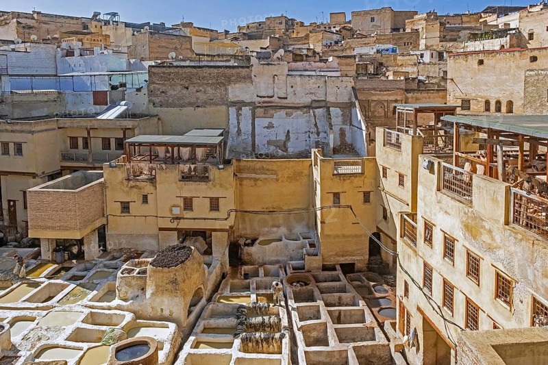 Sidi Moussa Tannery with round stone vessels filled with dye and softening liquids in medina Fes el-Bali of the city Fes