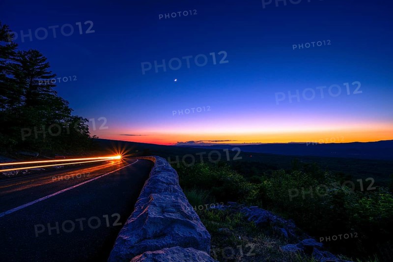 Sun sets behind the Catskills Mountains