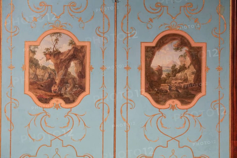 Painted wall panelling with landscape paintings