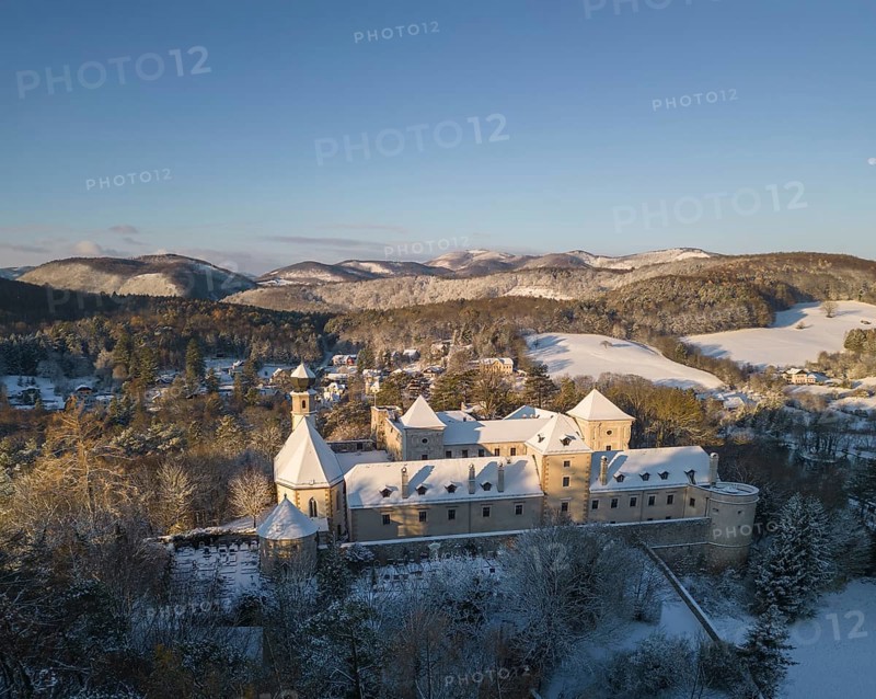 Aerial view of castle and church in winter