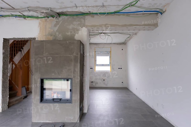 Room with newly laid electrical cables under the ceiling
