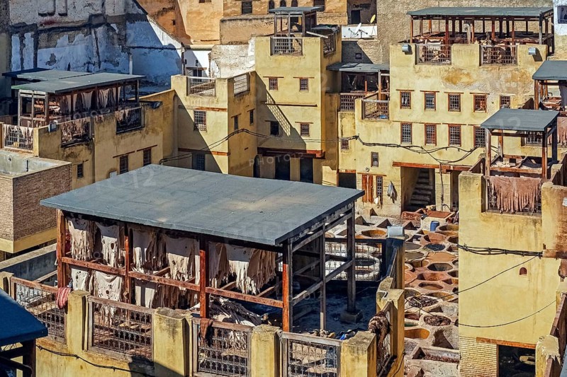 Sidi Moussa Tannery with round stone vessels filled with dye and softening liquids in medina Fes el-Bali of the city Fes