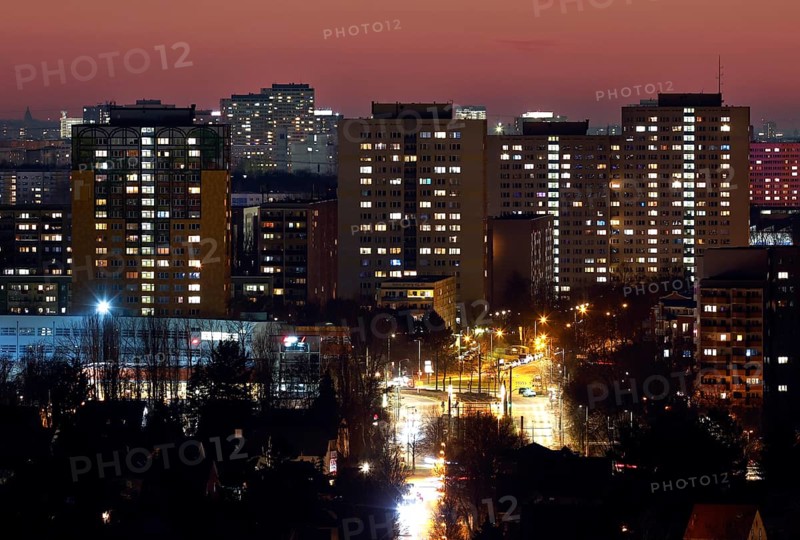 View in the evening at blue hour of high-rise buildings and apartment blocks with rental flats and condominiums in the Berlin district of Marzahn-Hellersdorf