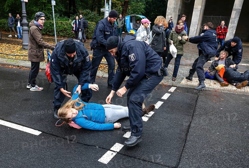 Police officers carry last generation climate activists from Strasse des 17. The Last Generation has called for a mass occupation action