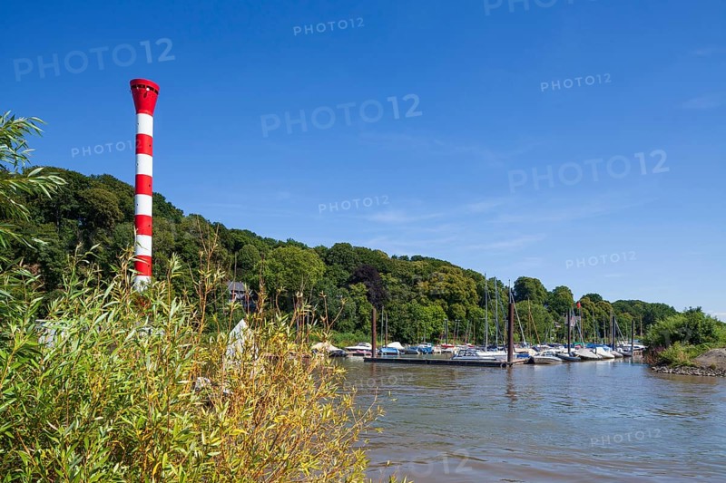 Dinghy harbour or Muehlenberg marina with lighthouse on the Elbe
