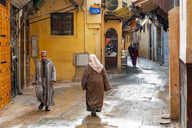 Muslim man and women wearing djellabas