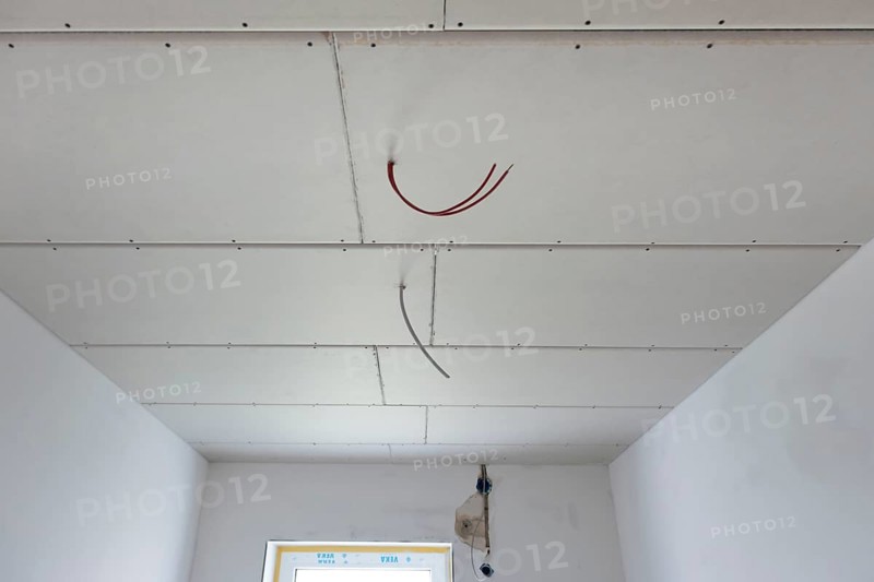 Plasterboard panels under the ceiling