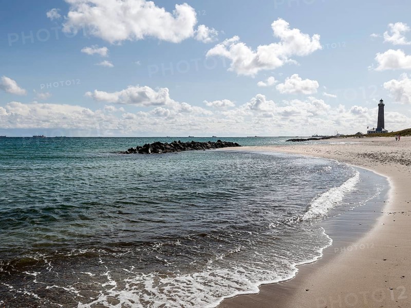 Baltic Sea beach with lighthouse in Skagen. Skagen is the only town in Denmark that lies on the North Sea and the Baltic Sea