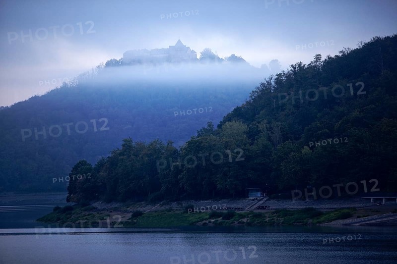 Lake Edersee with a view of Waldeck Castle in the morning mist