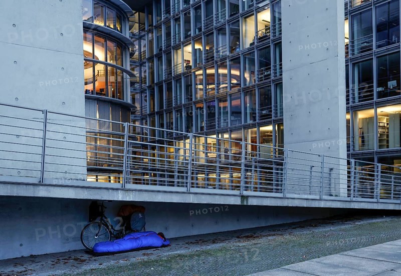 A homeless man sleeps in a sleeping bag at the Paul Loebe Haus. Aid organisations register an increase in homeless people