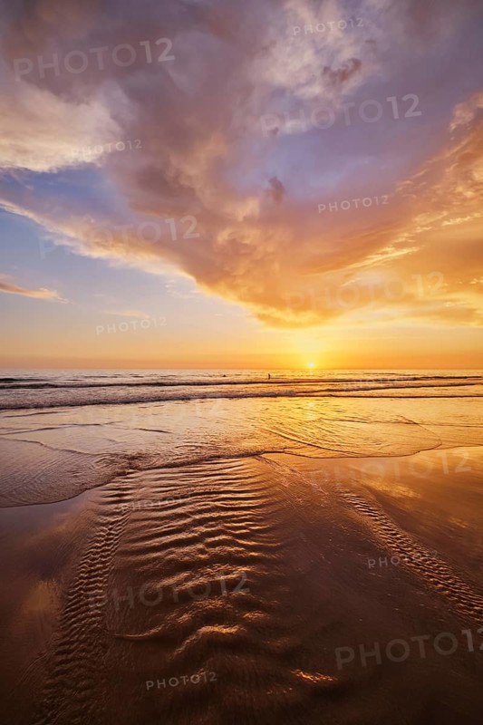 Atlantic ocean sunset with surging waves at Fonte da Telha beach, Costa da Caparica, Portugal, Europe