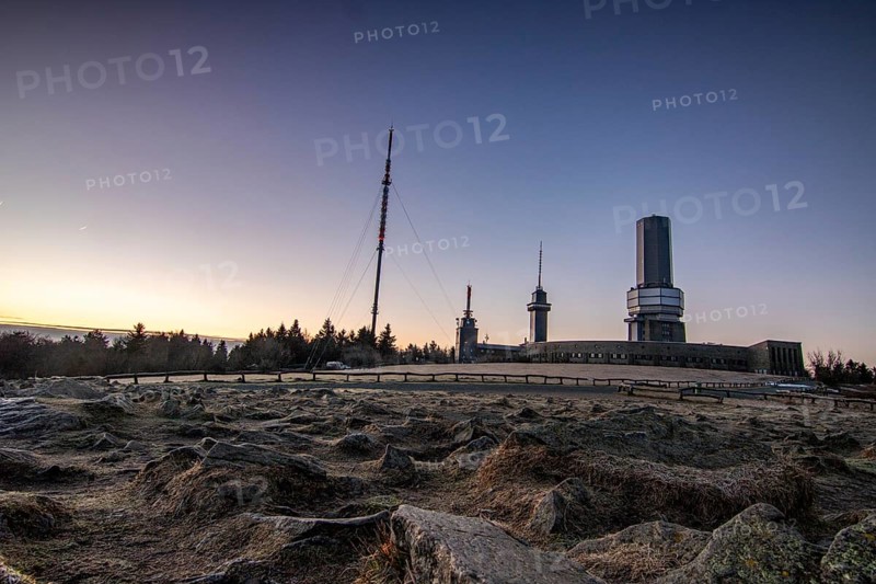 Landscape on the Grosser Feldberg, Taunus volcanic region. A cloudy, sunny winter day, meadows, hills, snow and forests with a view of the winter sunset. Hesse, Germany, Europe