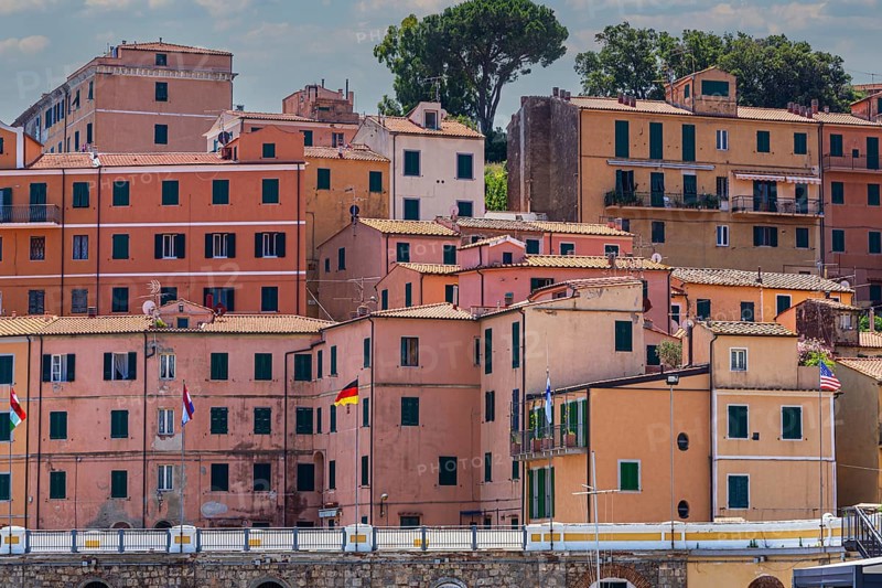 Interlocking houses with pastel-coloured facades in Rio Marina, Elba, Tuscan Archipelago, Tuscany, Italy, Europe