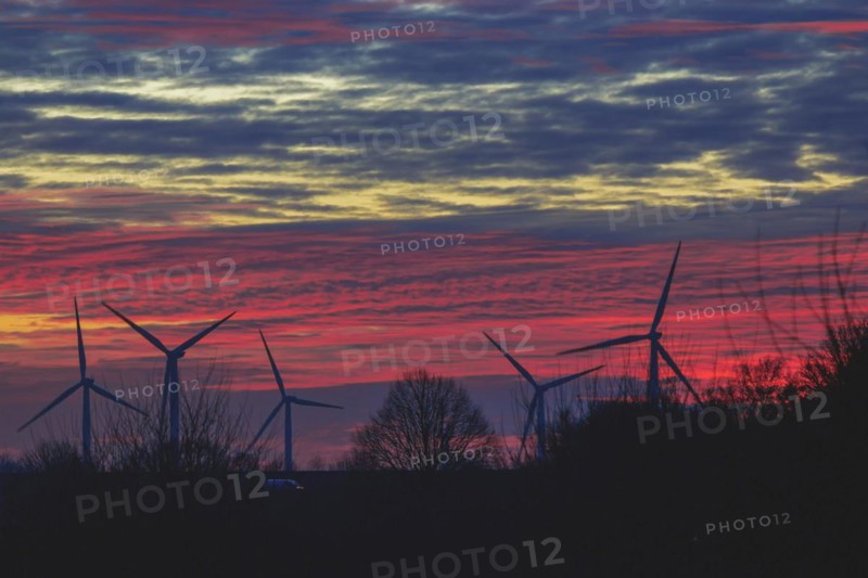 Silhouettes of wind turbines against a red evening sky, open-cast lignite mine, North Rhine-Westphalia, Germany, Europe