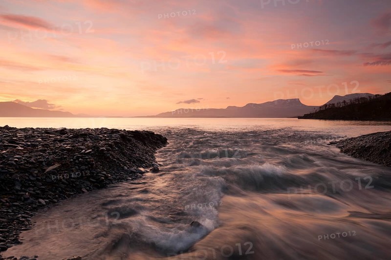 Sunrise at Lake Tornetraesk in Lapland. View of Abisko National Park and Laporten from Silverfallet