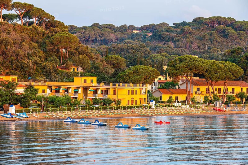 Pedal boats, sun loungers and parasols on the beach at Naregno at sunrise, near Capoliveri, Elba, Tuscan Archipelago, Tuscany, Italy, Europe