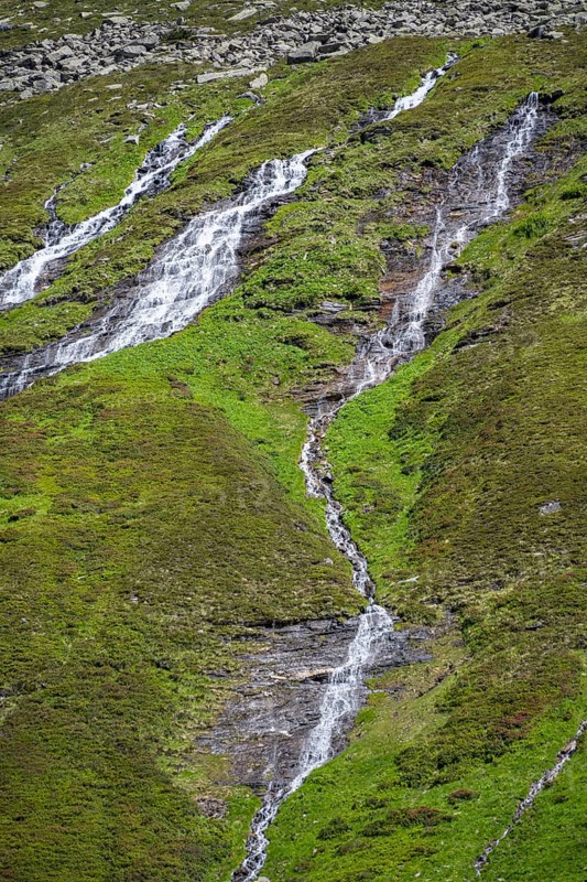 Waterfalls on a green mountainside, Berliner Hoehenweg, Zillertal Alps, Tyrol, Austria, Europe